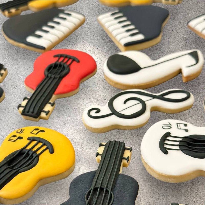 Close-up of a music-themed sugar cookie with icing detail