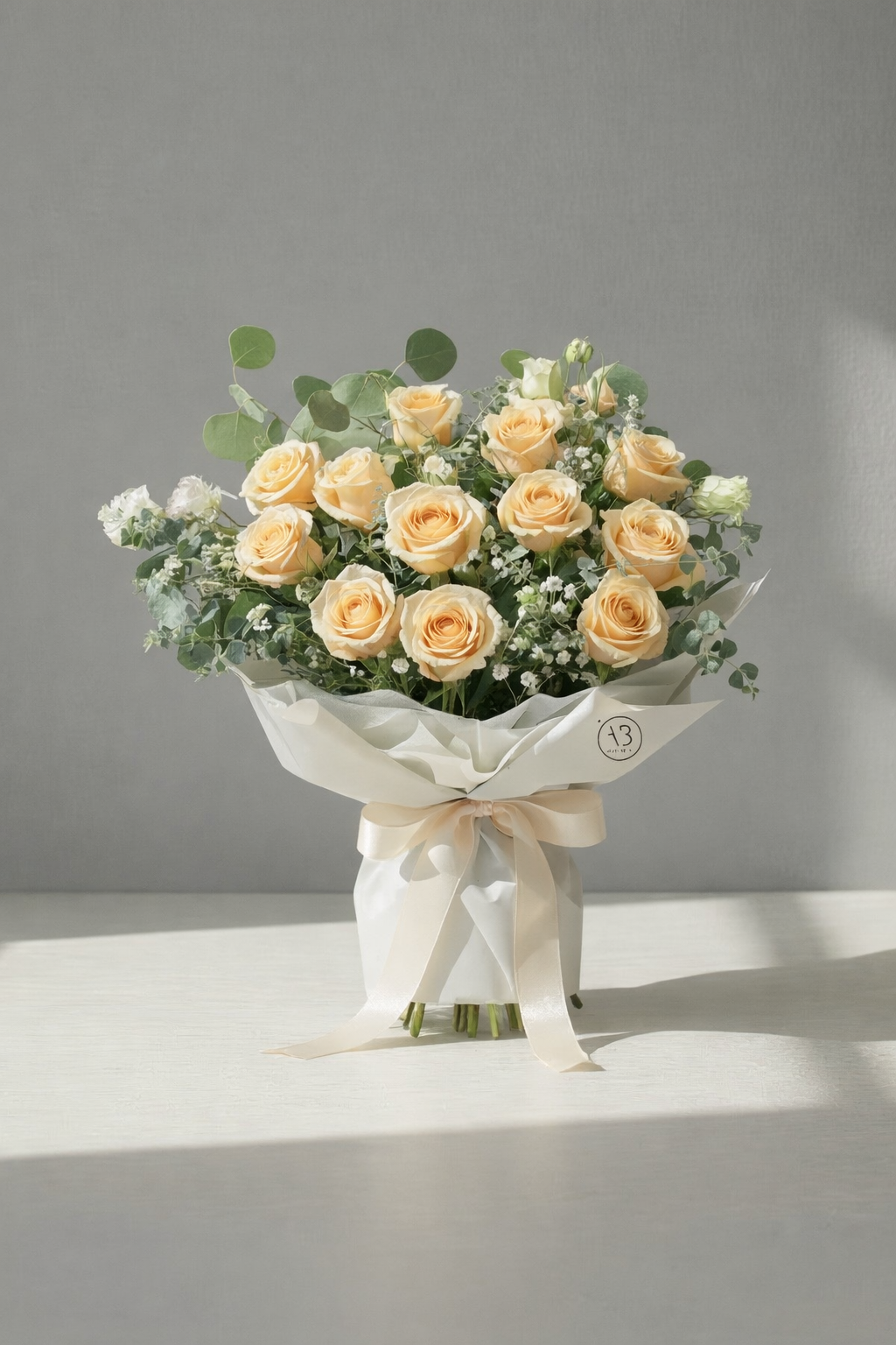 Blush pink fresh flower bouquet wrapped in soft paper