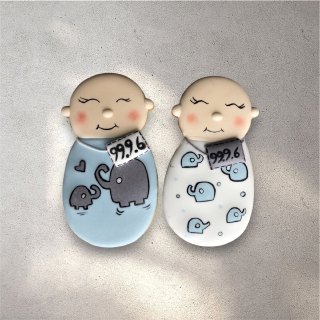 Blue and white decorated cookies with baby boy themed icing designs
