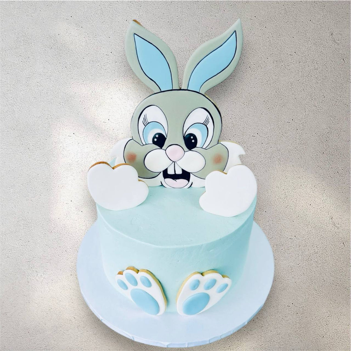 Custom cake decorated with a cute pastel bunny design