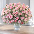 Soft pastel flower arrangement for a new baby gift