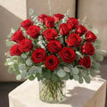 Deep red flower arrangement in a vase, bold Valentine's bouquet