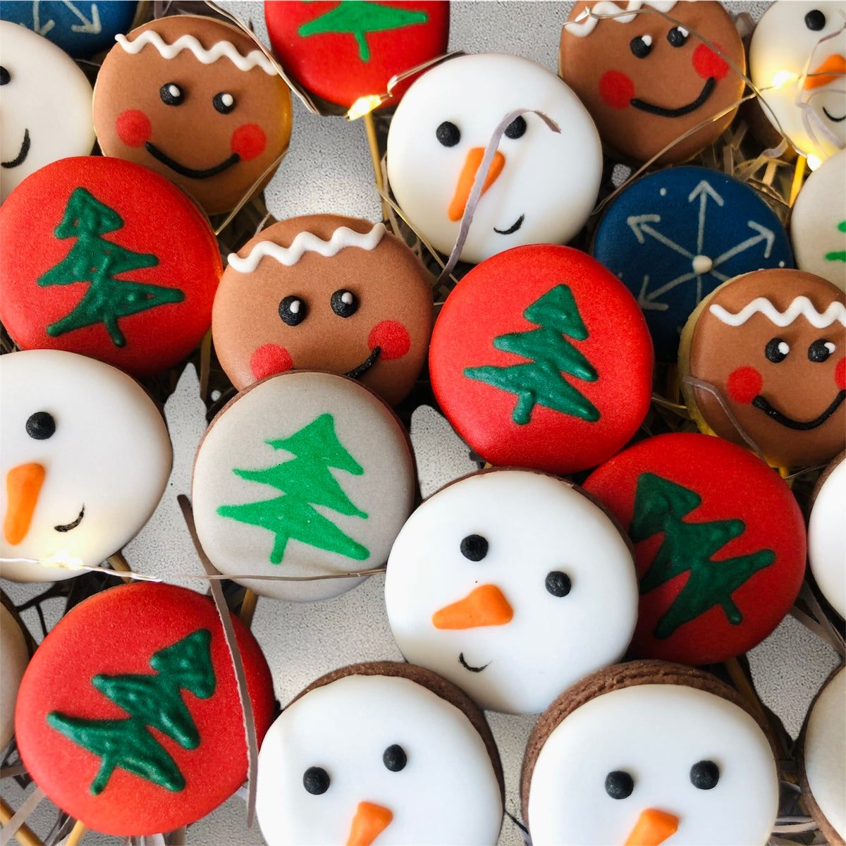 Assorted festive decorated mini cookies arranged on a platter