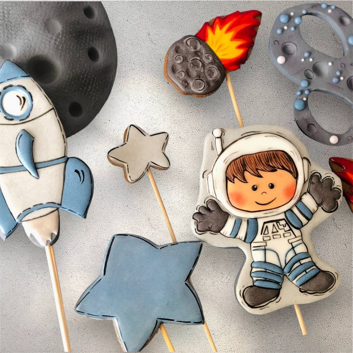 Black and gold star-themed cookie cake topper set