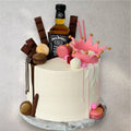 Two-tone custom cake split into his and her design with contrasting fondant halves