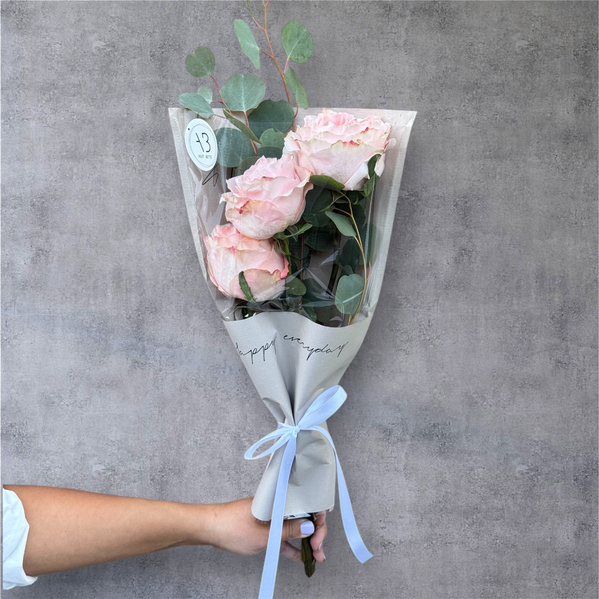 Soft pastel fresh cut flower bouquet wrapped for gifting