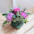 Bright mixed flower vase arrangement with seasonal blooms