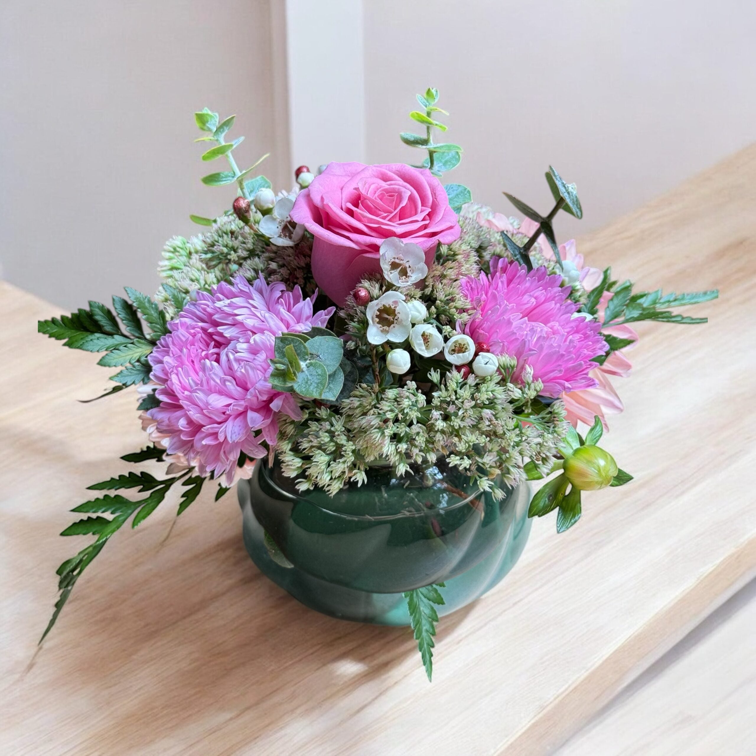 Bright mixed flower vase arrangement with seasonal blooms