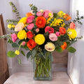 Vibrant, colourful flower vase arrangement with mixed blooms