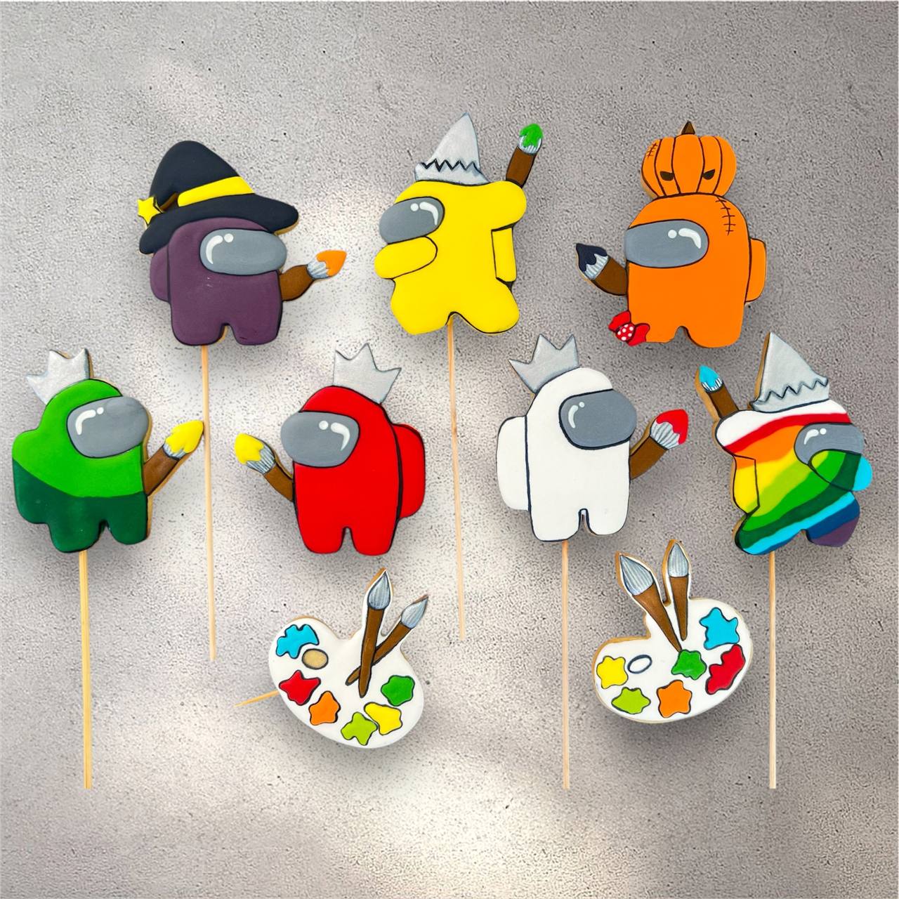 Decorated sugar cookies shaped like colourful space-themed imposter characters