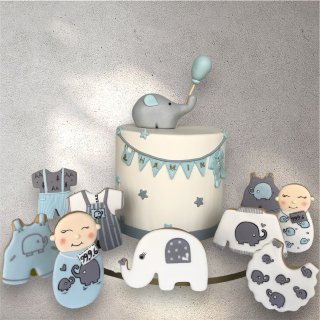Close-up of baby boy gift box with blue ribbon and sweet treats