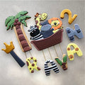 Individually decorated jungle animal cookies including lion and elephant shapes