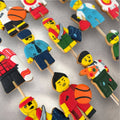 Colorful Lego-shaped decorated sugar cookies stacked together