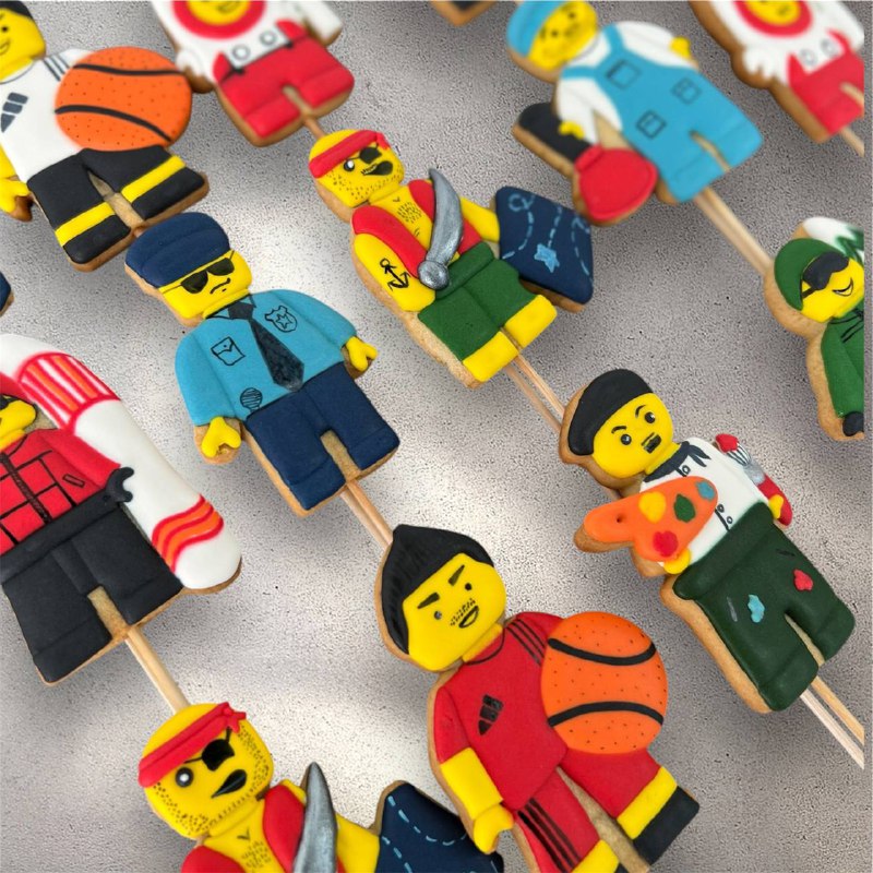 Colorful Lego-shaped decorated sugar cookies stacked together