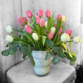 All-white flower vase arrangement with green accents
