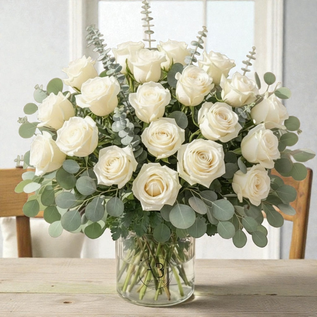 All-white flower vase arrangement with roses and white blooms