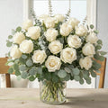 All-white flower vase arrangement with roses and white blooms