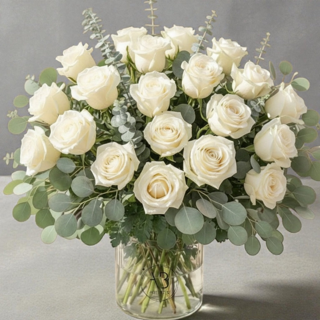 Side view of elegant white floral vase arrangement on a table