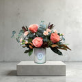 Blush pink flower vase arrangement with delicate greenery