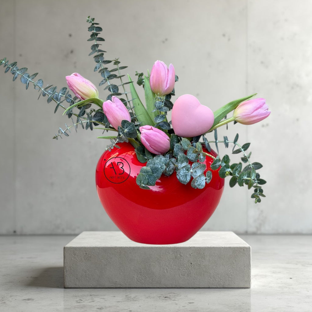 Red rose arrangement in a glass vase, ready for Vancouver delivery