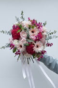 Romantic pink rose bouquet wrapped in paper for gifting