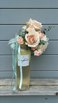 Neutral-toned flower gift box arrangement with soft greenery accents