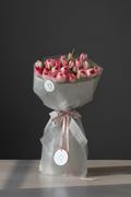 Fresh white flower bouquet with soft greenery wrapped for gifting