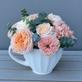 Designer's-choice vase arrangement with mixed seasonal flowers