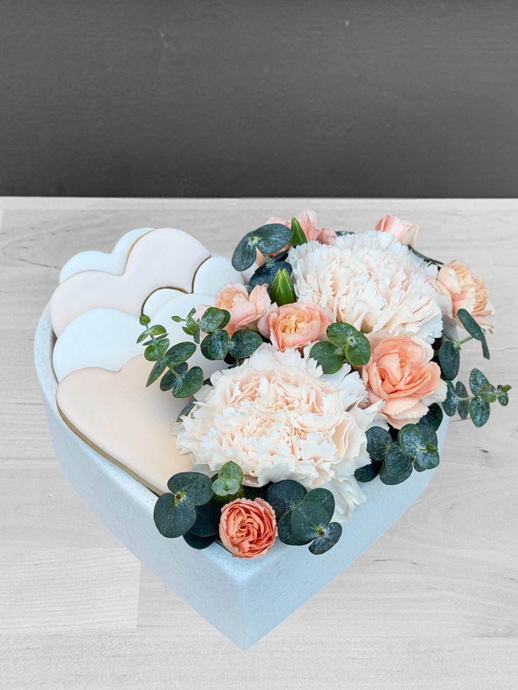 Close-up of Floretta gift box packaging with cookies and flowers