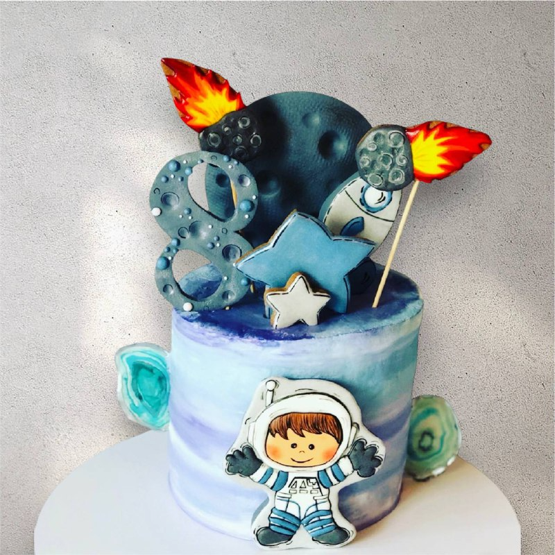 Rocket-shaped custom birthday cake with space and starship details
