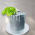 Custom cake decorated with colorful buttercream garden flowers