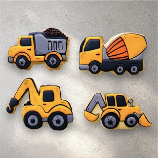 Hand-decorated truck-shaped sugar cookies in bright colors